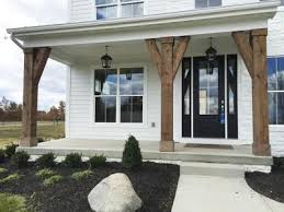 Black And White House With Wood Door 10725 Honeysuckle Way Custom Homes In Plain City Oh Dimagio In 2020 House Exterior Farmhouse Exterior Front Porch Design