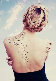They involve bright colors incorporating a complex intricate design or just a plain this specific tattoo idea again is ideal for the guy who wants something simple yet elegant. Birds Flying From Back To Shoulder Tattoo One Of The Best Adaptations Of This Design I Ve Seen Waist Tattoos Bird Tattoo Back Tattoos