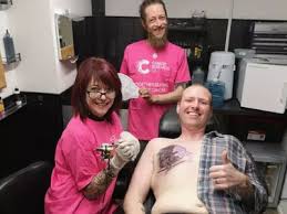 Cancer and breast cancer awareness tattoos are meant to commemorate the ones that stayed cancer ribbon and white anemone flowers. Black Bra Pink Ribbon Tattoo Chest Breast Cancer Awareness Man Gets 11 Inch Tattoo Of Black Bra Cup Pink Ribbon On His Chest For Breast Cancer Charity Trending Viral News