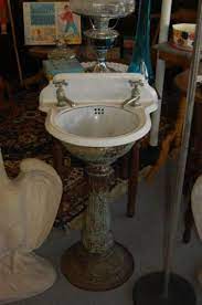 Antique Cast Iron Petite Pedestal Sink Vintage Train Sink Vintage Plumbinge Pedistal Sink Eclectic Bathroom Sink This vintage style pedestal sink brings trendy elegance and vintage style to any bathroom.