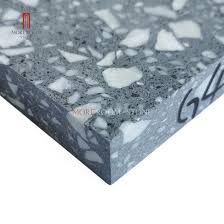 Because terrazzo is made by mixing small bits of material into a setting compound, most people choose to customize their surface. China White Marble Chips Dark Grey Terrazzon Cement Flooring China Artificial Stone Terrazzo