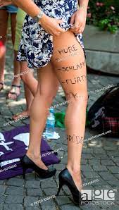 A woman shows her leg with the words 'Hure', 'Schlampe', 'Flirty', 'Ok..,  Stock Photo, Picture And Rights Managed Image. Pic. PAH-60104043 |  agefotostock