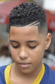 Not everyone can pull off a cute burst fade mohawk with a hair design, but if your kid can, we highly recommend it. 20 Eye Catching Haircuts For Black Boys Haircut Inspiration Black Boys Haircuts Boys Haircuts Black Boy Hairstyles