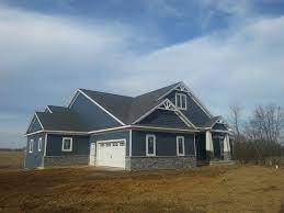 If you're looking for the highest level of quality and performance, contact us for a free estimate on installing vinyl pacific blue siding. Certain Teed Pacific Blue Siding On Craftsman Style Ranch With Laytite Stone House Exterior Blue House Exterior Blue Siding