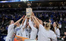South Dakota State Players Hoist The Summit League Women S Basketball Tournament Championship Trophy Tuesday At The Denny Basketball Tournament League Wahpeton