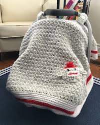 Catpaulino1 On Instagram Another Crochet Carseat Canopy This One A Sock Monkey Blanket Crochet Crochet Sock Monkeys Crochet Monkey Crochet Carseat Canopy