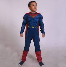 Young muscular man playing with a globe. Deluxe Boys Muscle Superman Costume Costume Party World