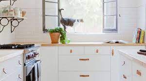 This fresh gray kitchen pairs rustic warmth with modern styling details. 3 Designers Share Outdated Kitchen Trends To Retire