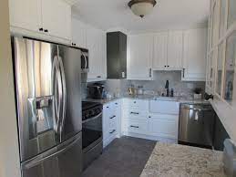 Our Small 50 S Kitchen Makeover Ikea Lindingo Cabinets White Spring Granite Counters Leonia Silver 50s Kitchen Makeover Fireclay Farmhouse Sink Silver Tile