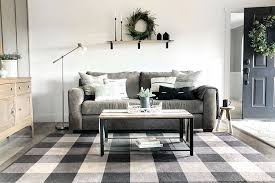 A white and gray marble tile floor and brown rug lead to a contemporary gold and black kitchen that features a glass door refrigerator, gold. 6 Ways To Style Your Black And White Buffalo Plaid Rug Ruggable Blog