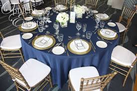 Gold And Navy Wedding Gold Tiffany Chair Navy Linens Gold Charger Plates At The Anchorage Port Stephe Wedding Furniture Wedding Hall Decorations Gold Chair
