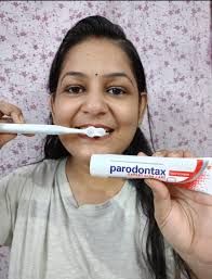 I am reaching out for advice regarding my sister's brown gums, which she  first noticed after pregnancy. She has a strong commitment to oral hygiene,  brushing and flossing twice daily, and has