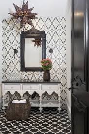 Black And White Moroccan Floor Tiles A Black Door Opens To A Moroccan Style Bathroom Clad In Black And White Marble Quatrefoil Floor Tiles Black Marble Bathroom Bathroom Styling Moroccan Bathroom