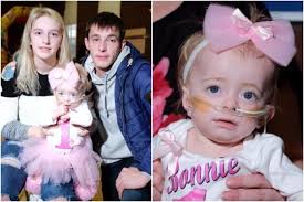 Scots tot battling Alzheimer's celebrates landmark first birthday as  parents brand her 'little fighter'