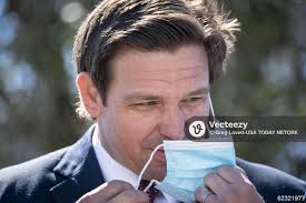 Florida Governor Ron DeSantis prepares to speak at a press conference at a  COVID-19 vaccination site at Anquan Boldin Stadium in Pahokee, Florida