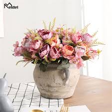 The artificial arrangement is in a cylinder shape and filled with faux (fake) water to add realism to the work. 5 Heads Small Silk Peony Artificial Flowers Bouquet Fake Flowers Bridal Bouquet For Wedding Table Decor Home Vase Indoor Flowers Wedding Bouquets Aliexpress