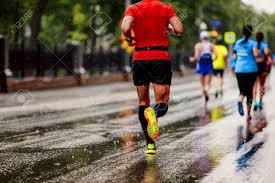Sharing the highs, the lows, the thrills and spills, the tips and slips and the incredible achievement of training for, and running marathons. Group Of Runners Men And Women Running Under Rain Drops City Marathon Stock Photo Picture And Royalty Free Image Image 97199319