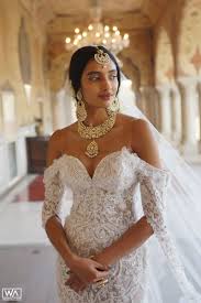 Jewelry for off the shoulder dress. Such A Unique Way Of Pairing Indian Traditional Bridal Jewellery On An Off Shoulder Wh White Indian Wedding Dress English Wedding Dresses White Wedding Dresses