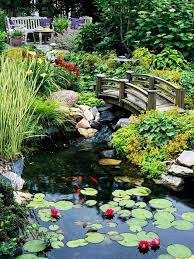 Cute Garden Setting With Large Fish Pond Over Bridge And Seating Area Source Www Bhg Com Ponds Backyard Backyard Water Feature Backyard Garden Design