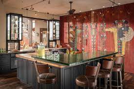 Large double ovens and range hoods, stainless steel back splash, utensil racks hung on the wall, subzero refrigeration, 2 sinks. Western Kitchen Decor Pictures Ideas Tips From Hgtv Hgtv