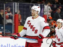 A black third jersey that features a new secondary logo. Carolina Hurricanes Jersey History