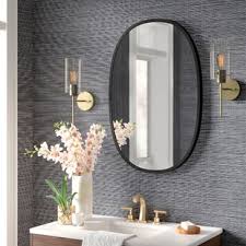 You can fix the oval or elliptical mirror wherever you want and in the position you prefer: Vanity Mirrors Joss Main