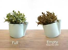 Thirst Place Tilting Pot Tells Owners When To Water Webecoist Flower Pots Self Watering Pots Self Watering Planter