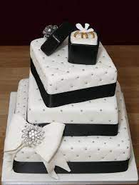 Essentially, any design that brings in color can be a striking pick for an engagement ring and thanks to designers both classic and contemporary, there's a slew of beautiful pieces to choose from. Off Set Squares And Lined Pattern With Jewels Dont Like The Black Ribbon Or Box Though Engagement Cake Design Engagement Cakes Wedding Cake Pictures