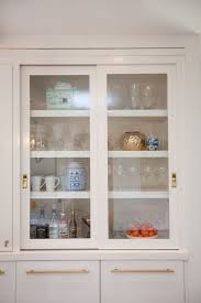 A Kitchen Makeover Modern Fresh And White Glass Cabinet Doors Sliding Glass Door Kitchen Door Handles