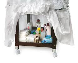 A double canopy covers the top of the bassinet. And Storage Canopy Elegance Round Wooden Baby Bassinet With Bedding