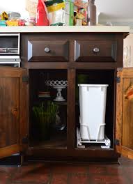 I cut some grippy drawer liner to fit inside to prevent the trash can. Installing A Pull Out Trash Can Young House Love