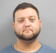 Two charged with murder in death of man found at home with venomous snakes