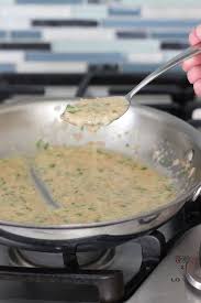 Roasted Salmon With White Wine And Lemon Butter Sauce Olga S Flavor Factory Recipe Roasted Salmon Lemon Butter Chicken Pasta Wine Butter