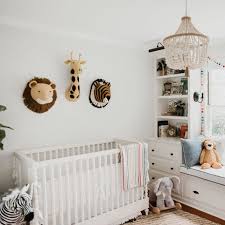 The Neutral Safari Nursery Has Some Amazing Pops Of Color And Psssst Score Select Animals Heads Safari Baby Room Neutral Safari Nursery Safari Toddler Room