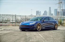 This package includes rear suspension adjustments to optimize ride quality. Subtle Unplugged Tesla Model 3 On Adv 1 Wheels