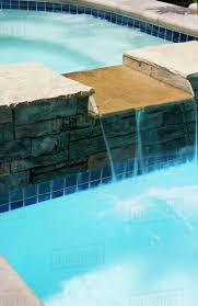The hot tub outpost is an authorized qca spa distributor. Waterfall From Hot Tub To Swimming Pool Stock Photo Dissolve