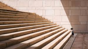 Toddler S Standing In Front Of Beige Concrete Stair Photo Free People Image On Unsplash In 2021 Stock Images Free Stairs Believe In You