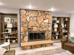 I did a ton of research (online counts right?) on different ways we could update it but in the end painting it just seemed to … Limewash Stone Fireplace Makeover Bye Bye Orange Stone Fireplace Hello Neutral Stone Beauty Average But Inspired