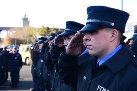 FDNY Firefighters drape purple and black bunting