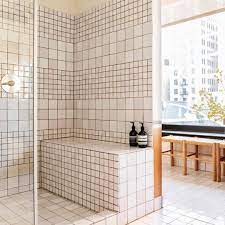 Colored grout is generally made of a cement and sand combo, then mixed with water before application. The Difference Grout Color Can Make To Your Tiles Emily Henderson