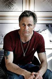 Viggo Mortensen By Arnthor Birkisson Taken At An Exhibition Of Viggo S Photos In The Background Viggo Mortensen Balding Mens Hairstyles Actors