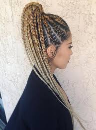 All the cornrows are spiraling upwards into an updo design. 20 Super Hot Cornrow Braid Hairstyles