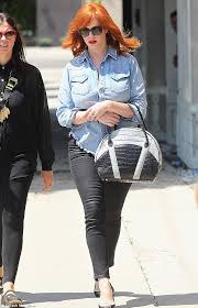It is easy to notice christina christina hendricks is known for her role in mad men, amc television series where she plays the. Christina Hendricks Accessorises Tattered Denim Shirt With 15 000 Handbag Daily Mail Online