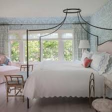 A baby pink sconce and blue upholstered headboard add some sweetness to the green and gray elements here, cathy kincaid painted the bed frame and used decorative pillows for a splash of blue. Pink And Blue Romantic Bedroom Design Ideas