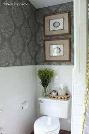 This cerulean blue is a refreshing color that can be balanced out with neutral features, such as the white and gray shades in the cabinetry, rug and sink. Our Stenciled Bathroom Budget Makeover Reveal Driven By Decor