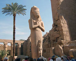 Image of modernday Egyptians visiting Karnak, expressing their connection to their heritage and the enduring legacy of the temple.