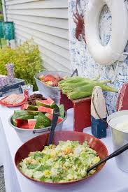 Traditionally, a clambake is prepared by digging a hole in the ground—if you're near the beach, even better. Cookout Table Setup Clam Bake Crab Boil Party Pig Roast Party