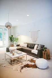 6 Reasons Layering Rugs Will Make Your Home More Stylish Rugs In Living Room Home Living Room Hide Rug Living Room