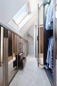 This attic has a very natural look like it is styled straight out of raw wood, while the dark chocolatey beams holding up the ceiling the white gossamer bed curtains shield the traditional bed from view while the wooden interiors give a warm and very romantic feel to this attic. 26 Creative And Smart Attic Storage Ideas To Try Shelterness