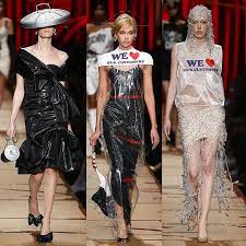 Models Wearing A Garbage Bag Dress With A Trash Can Lid Hat A Dry Cleaning Bag Dress With A Sock Handbag And A Plasti Bag Dress Plastic Dress Trash Bag Dress